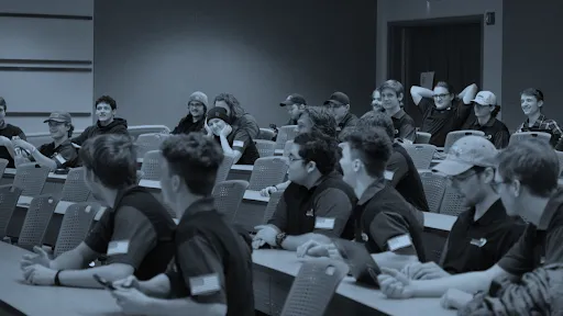 Students in a meeting discussing Enterprise projects